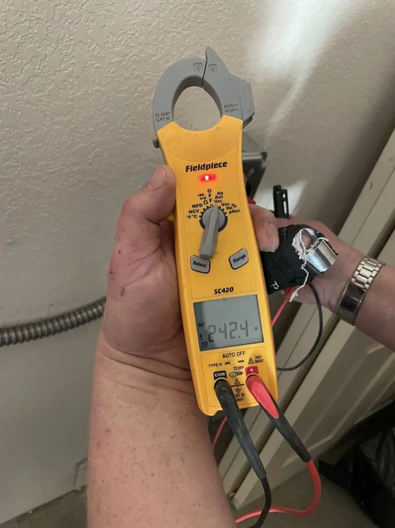 Voltage testing with clamp meter during Recessed Lighting Installation in Kent